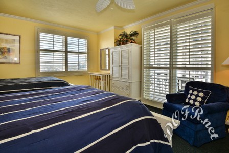 Guest Bedroom features Private Balcony Through Plantation Shutters
